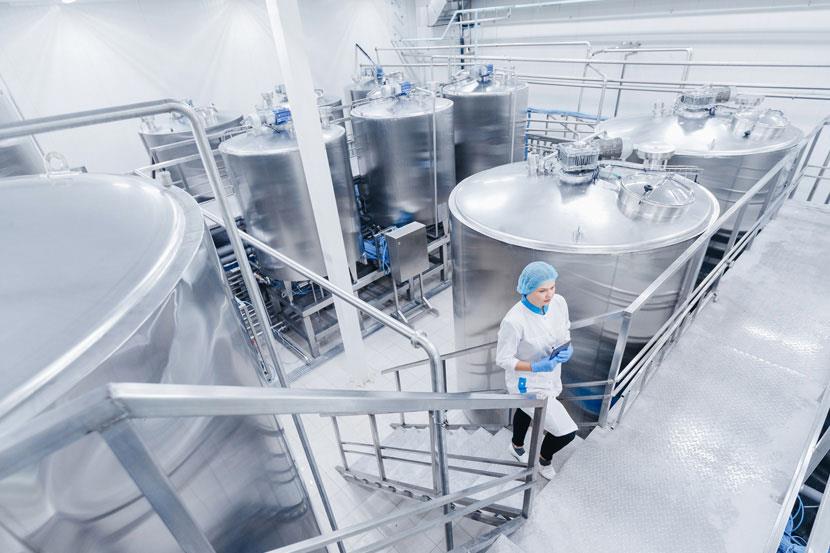 Person walking up stairs in an industrial medical facility